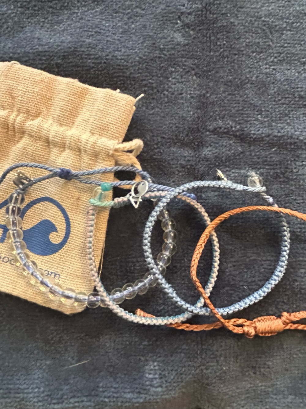 Bundle 4Ocean 4 blue/coral beaded/braided bracelets, new w/bag.